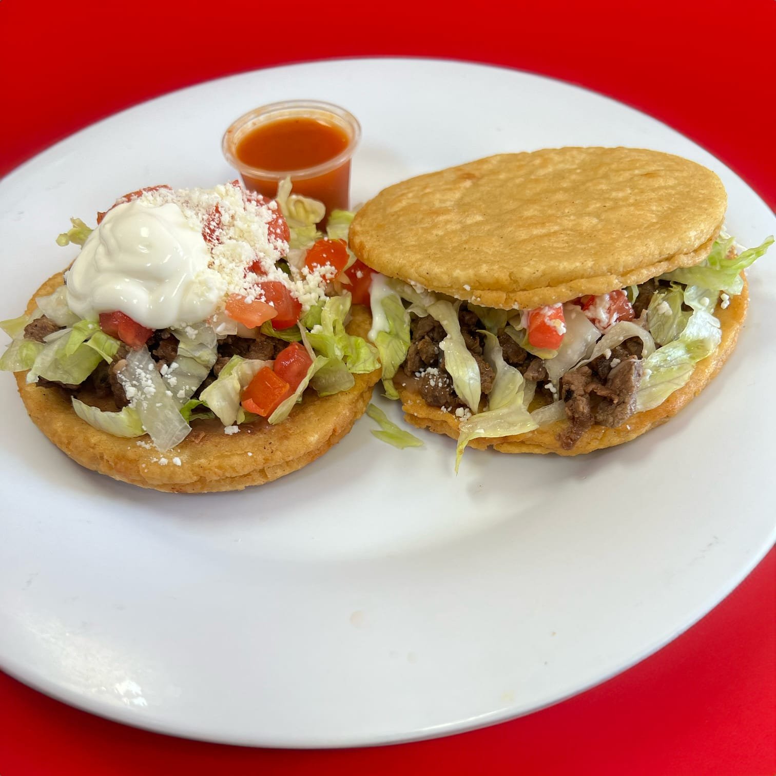 A freshly made gordita from La Bendición, filled and griddled to order